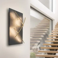 Grote design wandlamp met gouden kapjes