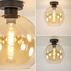 Mat zwarte plafondlamp met amber glazen bol